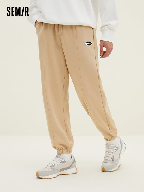 Men's UT Interlock 3D Badge Loose Knitted Jogging Pants