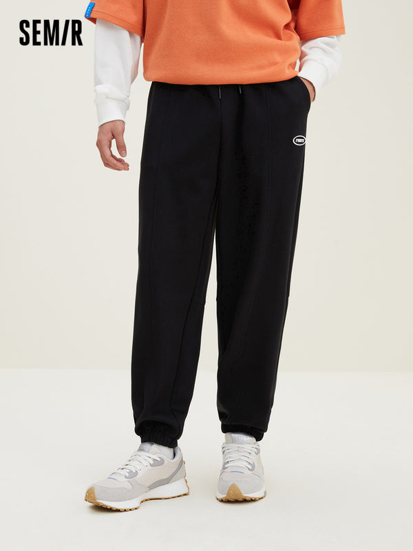 Men's UT Interlock 3D Badge Loose Knitted Jogging Pants